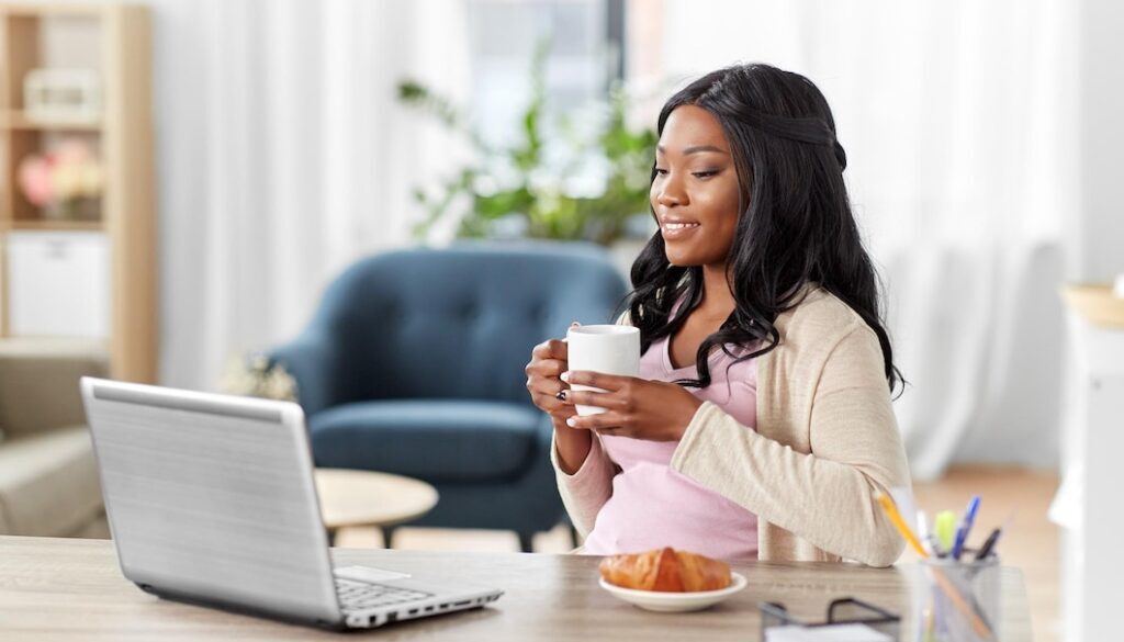 happy-woman-with-laptop-coffee-home-office_380164-256248