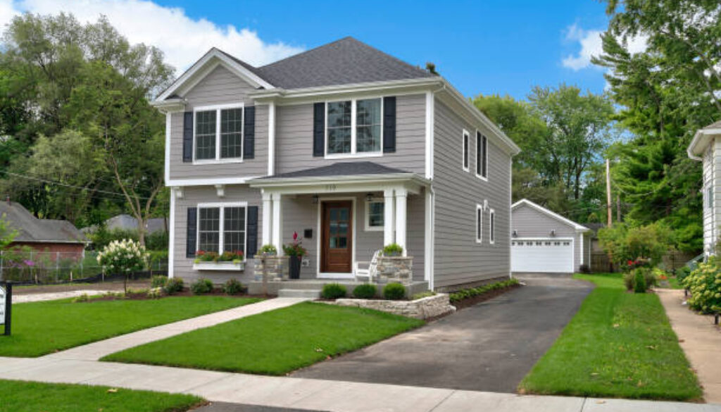 Driveway leads from street to back detached garage