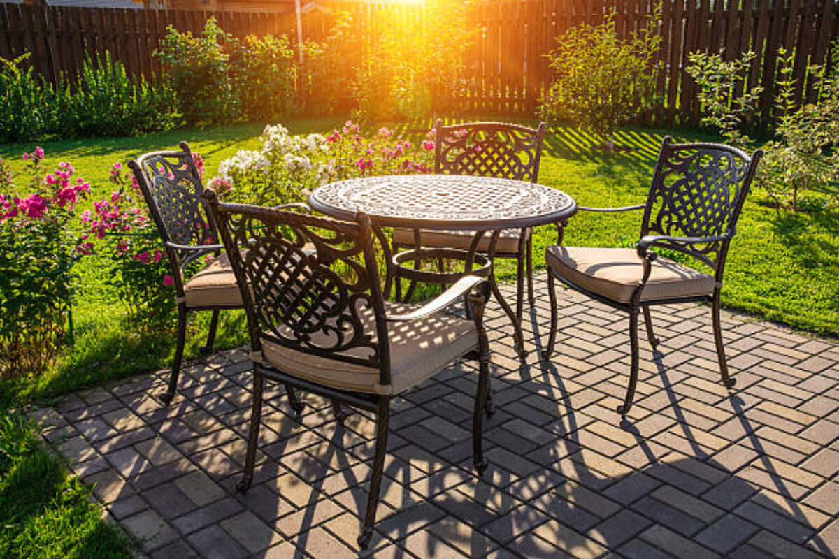 Table and chairs in garden of country house. Selective focus