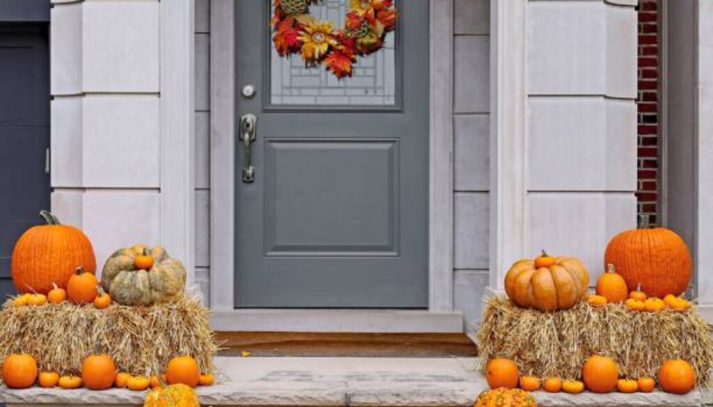 Front steps of house with pumpkins and fall decorations